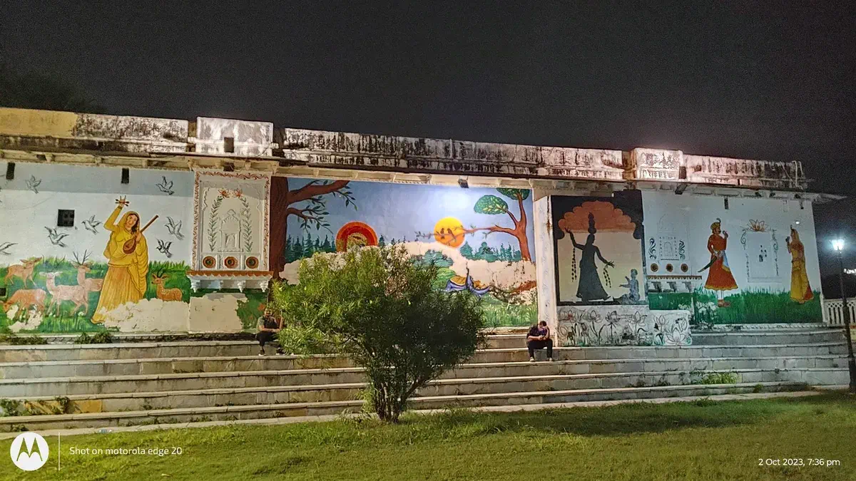 The beautifully lit temples reflecting in the lake at night.